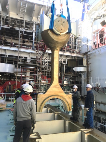 Philly Shipyard staff lower the connecting rod for installation