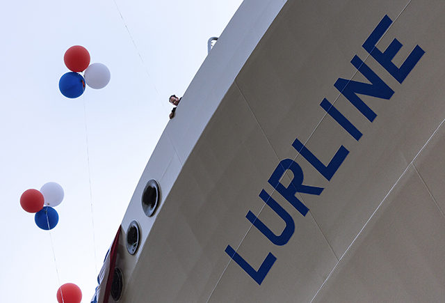 Lurline name painted on the side of the ship with red, blue and white balloons