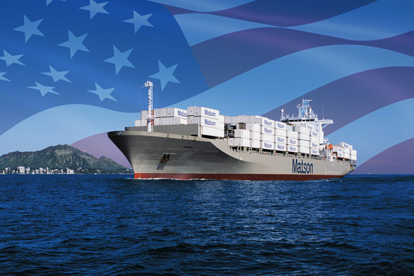 Matson ship loaded with containers arriving Honolulu with imposed American flag in the background.